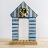 NOM // Wooden Beach Shack With Wreath