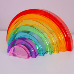 Lucite rainbow stacking arches — translucent acrylic, 7 pieces