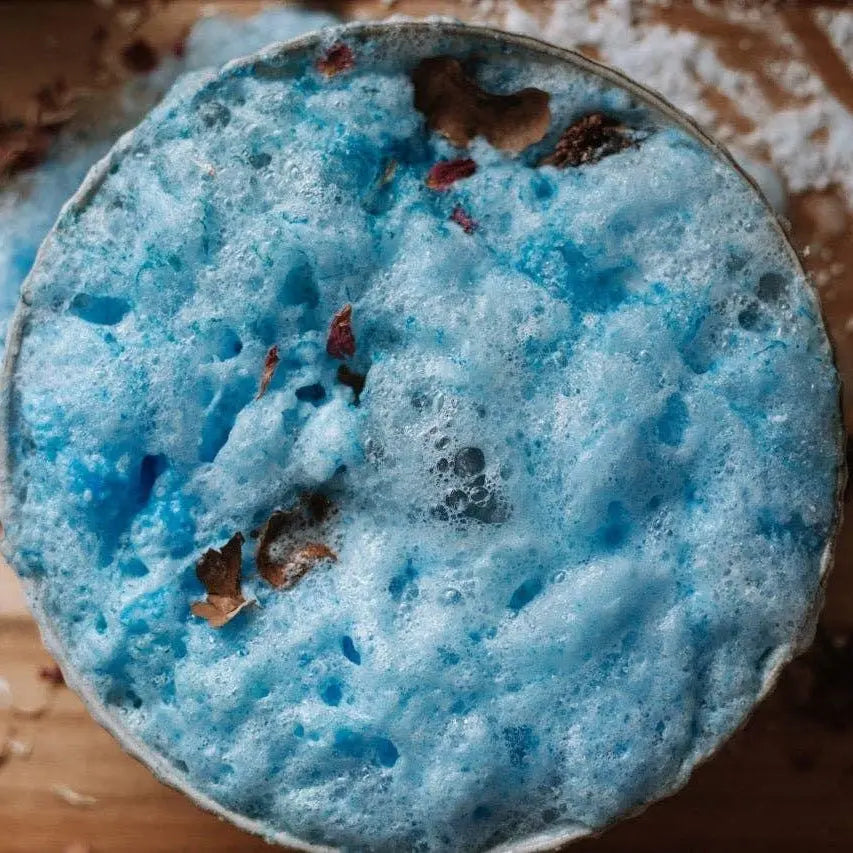 Close-up of a blue play fizz with a wooden surface in the background